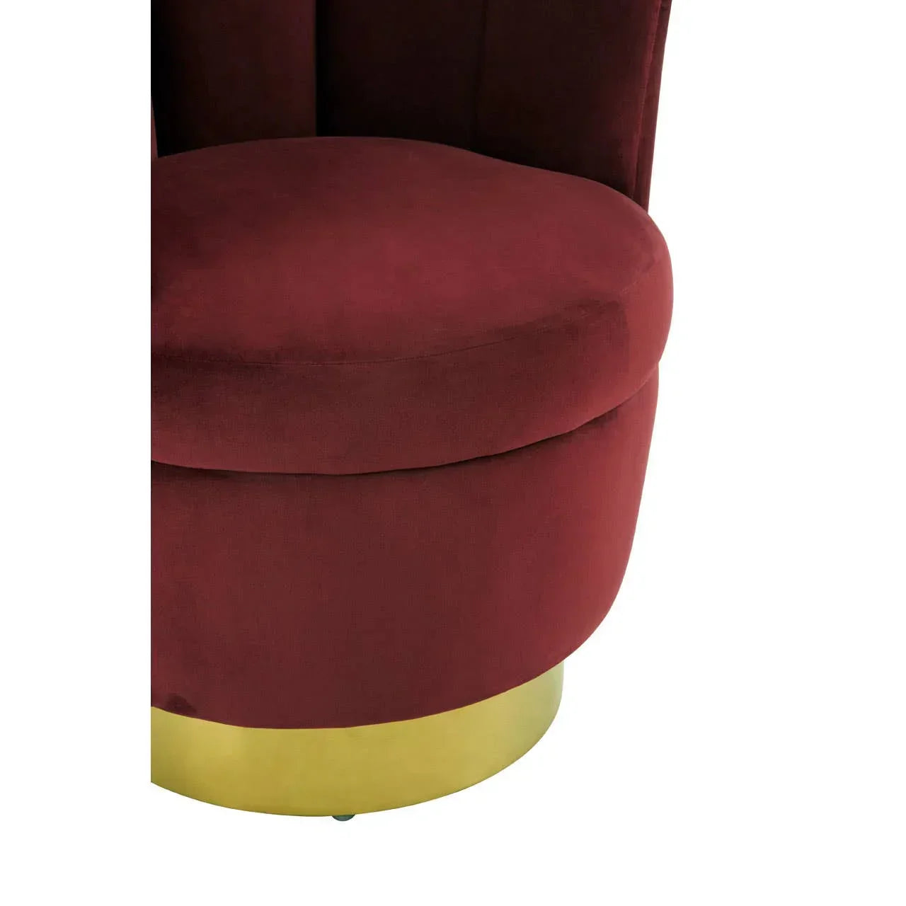 Velvet accent chair in deep red with gold base, close-up of seat and lower section