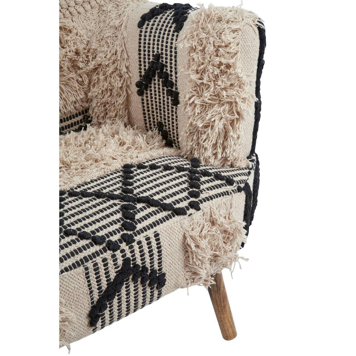 Textured beige armchair with black geometric pattern and wooden leg close-up