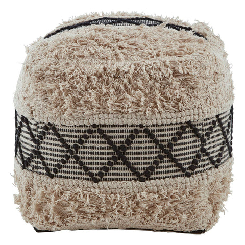 A square pouffe featuring a shaggy texture in a beige color with black geometric patterns around the middle. The pouffe has a soft, plush appearance, making it suitable for use as a footrest or additional seating