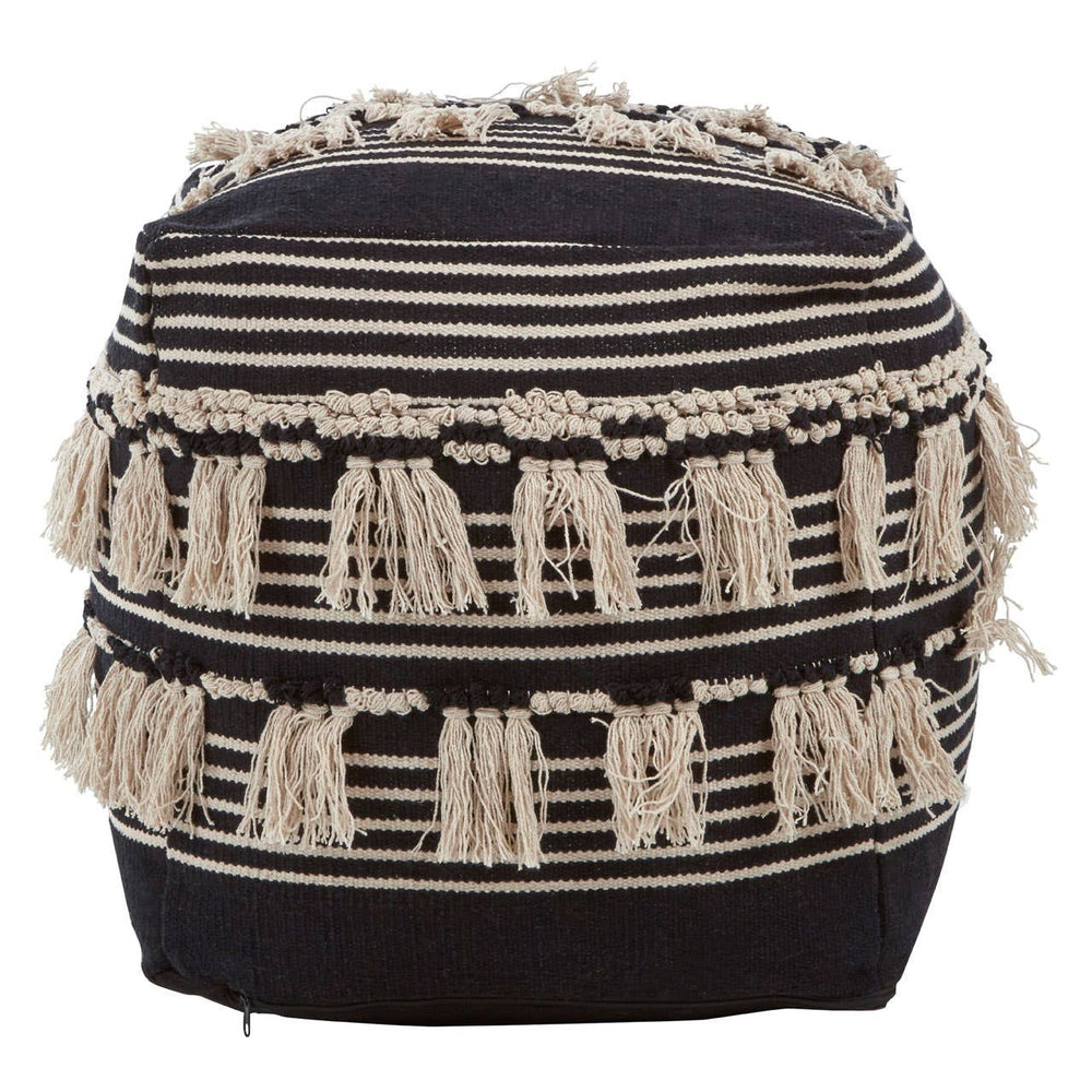 Round pouffe featuring a black and white shaggy design with textured fringes. The pouffe has a cylindrical shape and is adorned with horizontal stripes of varying thickness in black and cream colors
