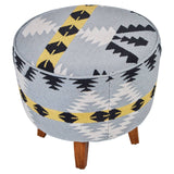 Round footstool featuring a colorful Kilim-style fabric with geometric patterns in blue, black, and yellow, supported by four tapered mango wood legs