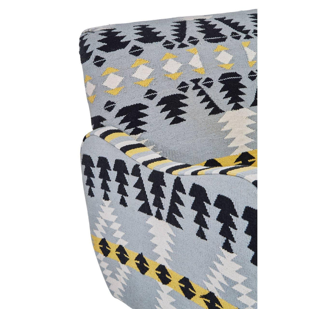 Close-up of patterned armchair with blue, black, yellow and white geometric upholstery