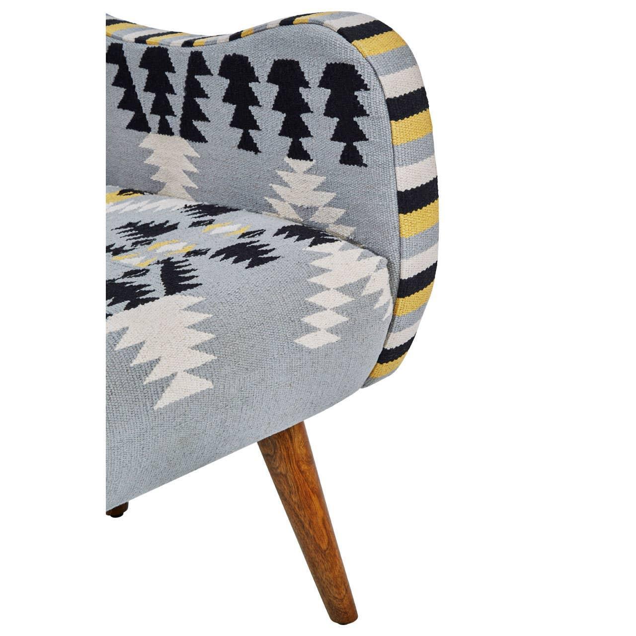 Patterned fabric armchair with wooden leg and geometric navy, white, yellow upholstery