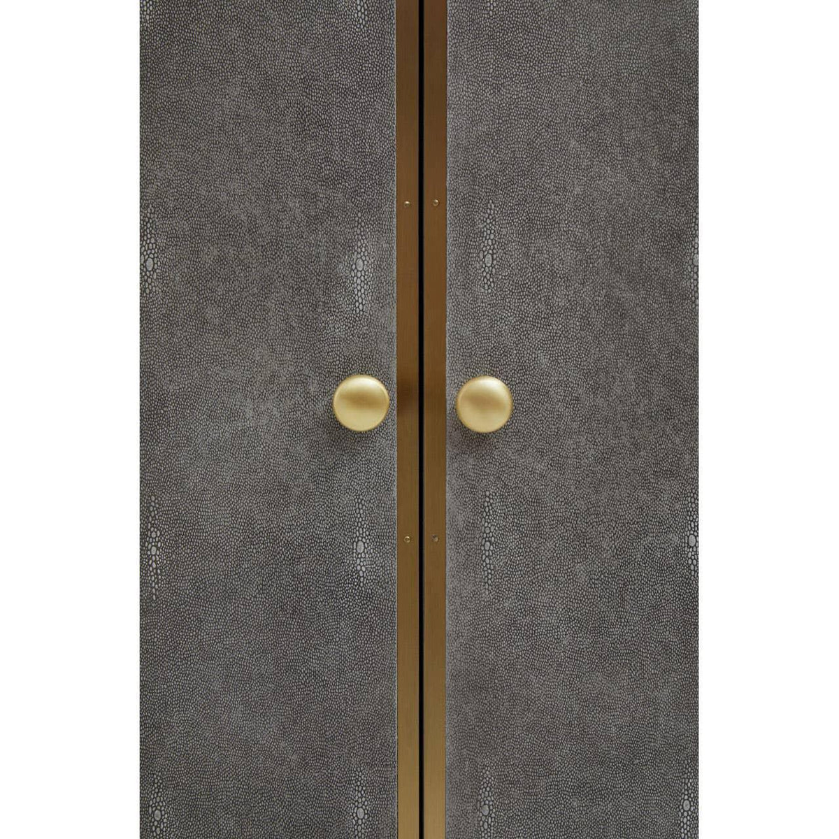 Textured cabinet doors with gold handles and central gold trim detail