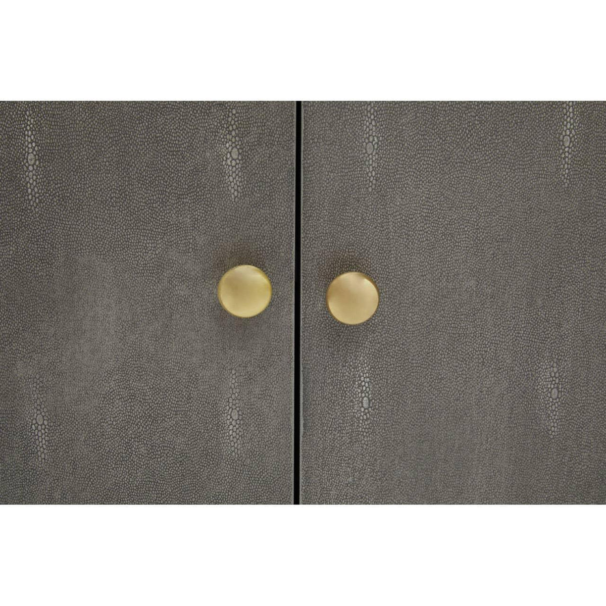 Textured grey cabinet doors with gold round handles, close-up furniture detail