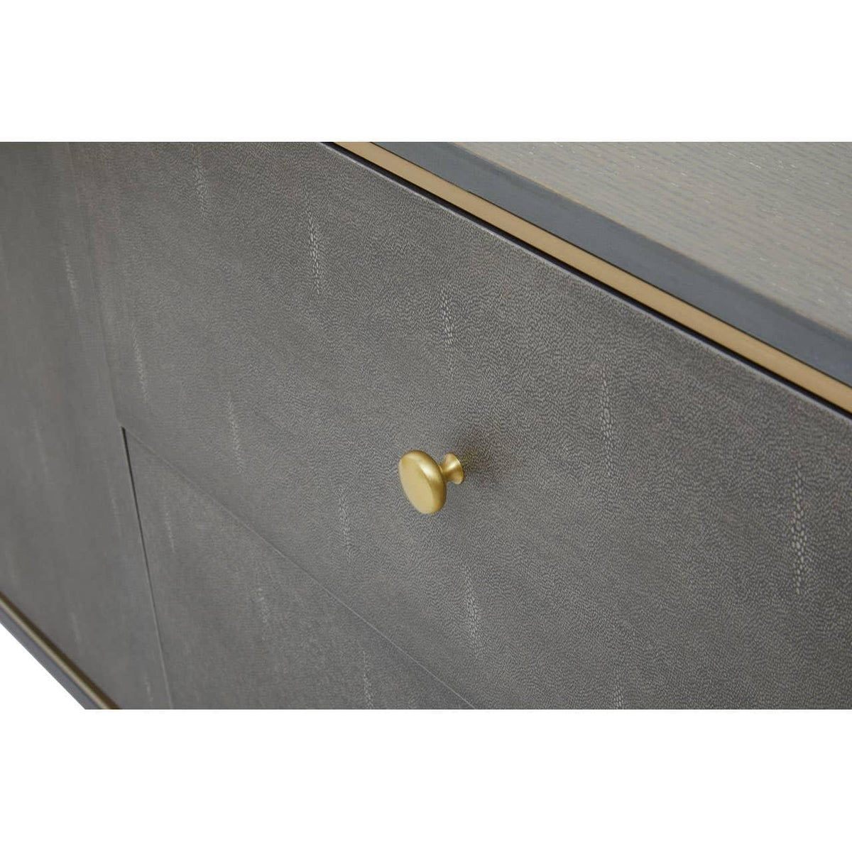 Close-up of grey cabinet drawer with textured finish and gold metal handle