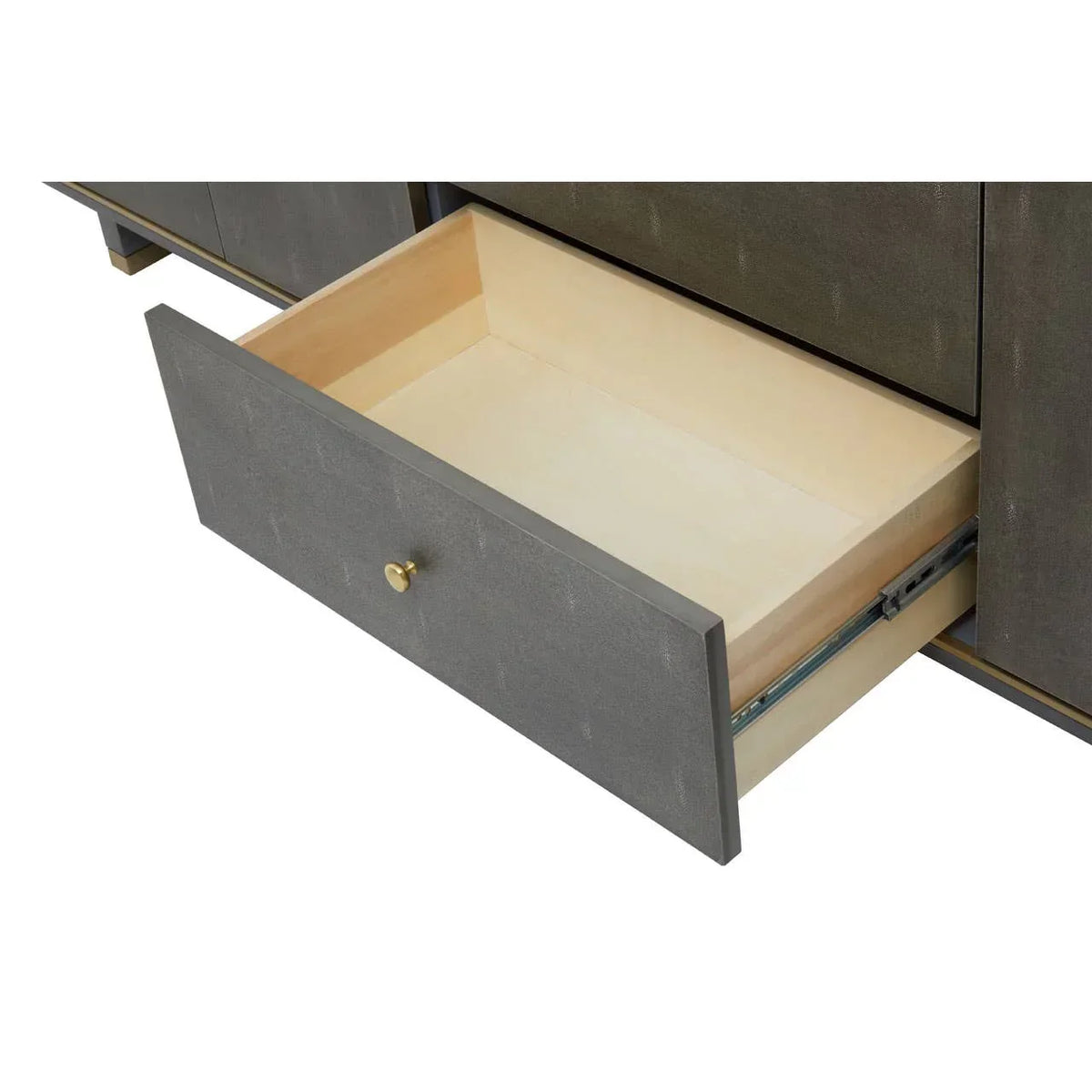 Grey wooden sideboard drawer with brass knob shown open on metal runners