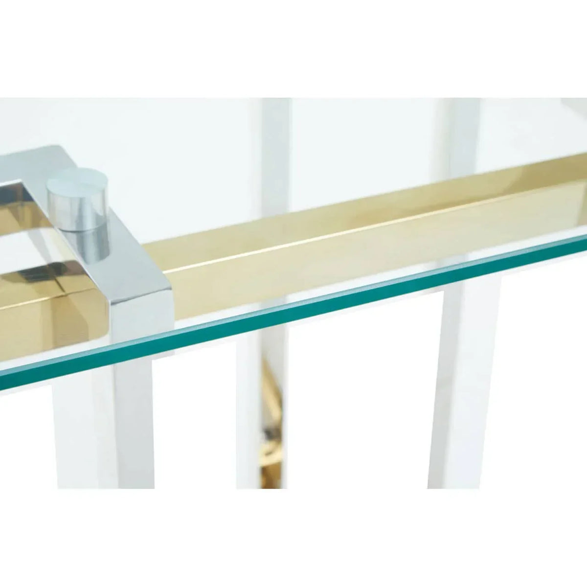 Closeup of glass dining table with gold and chrome metal frame detail