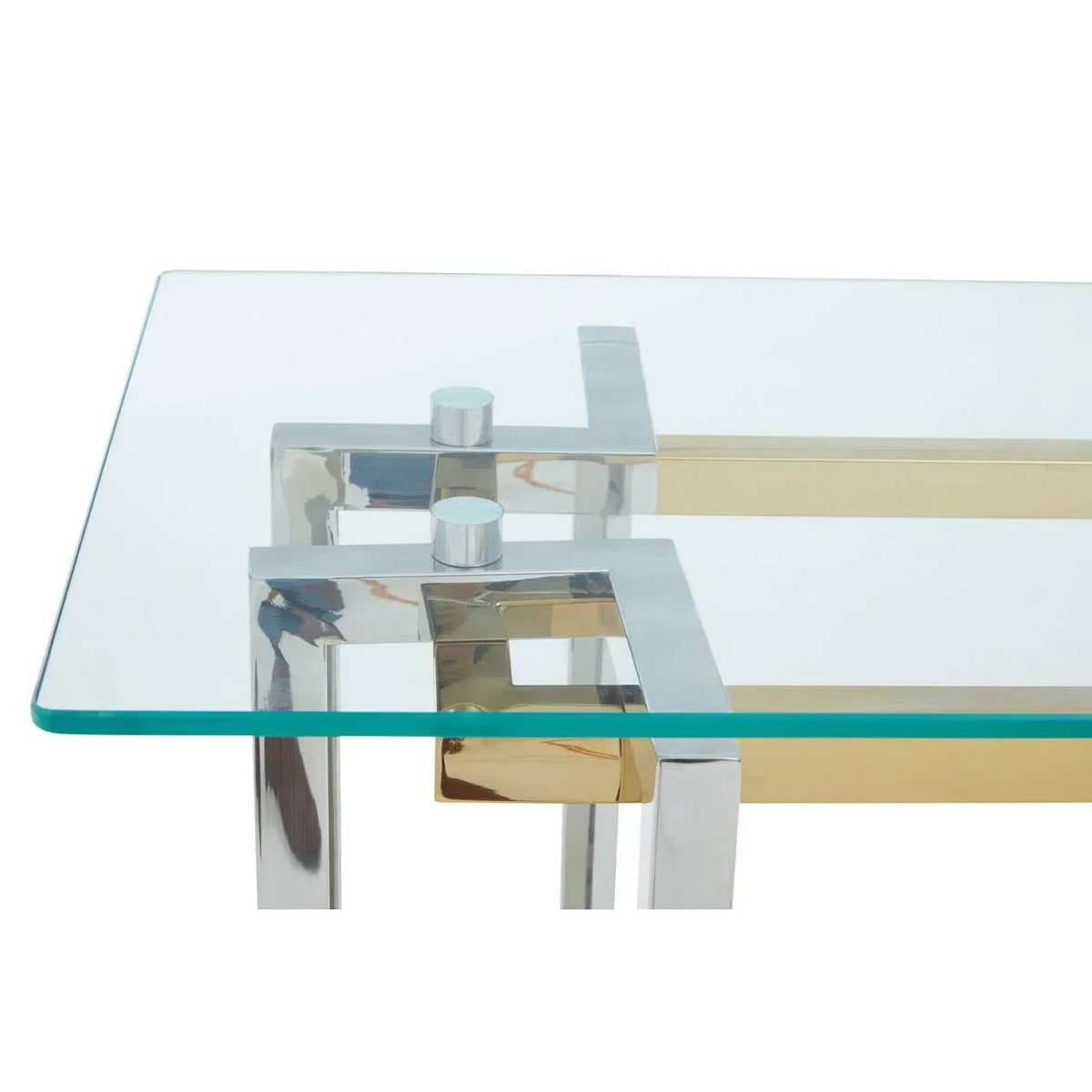 Glass coffee table with chrome and gold geometric frame, closeup of corner detail