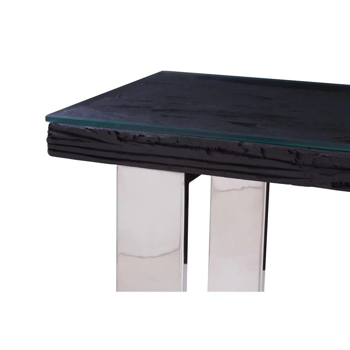 Glass top dining table with textured black wood edge and chrome metal legs close-up