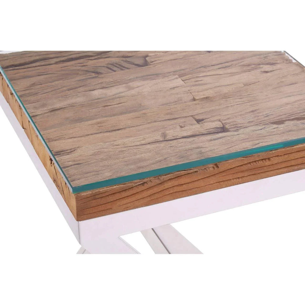 Close-up of wooden dining table top with glass overlay and white metal legs