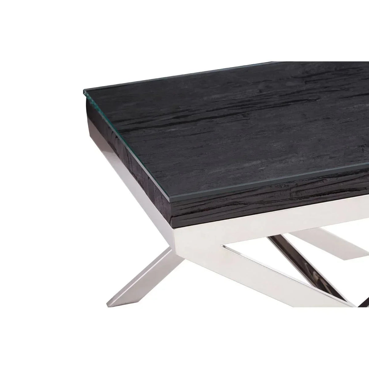 Black wood coffee table with glass top and chrome crossed legs, close corner view