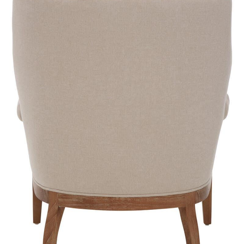 Beige fabric armchair with tufted backrest and wooden legs, rear view