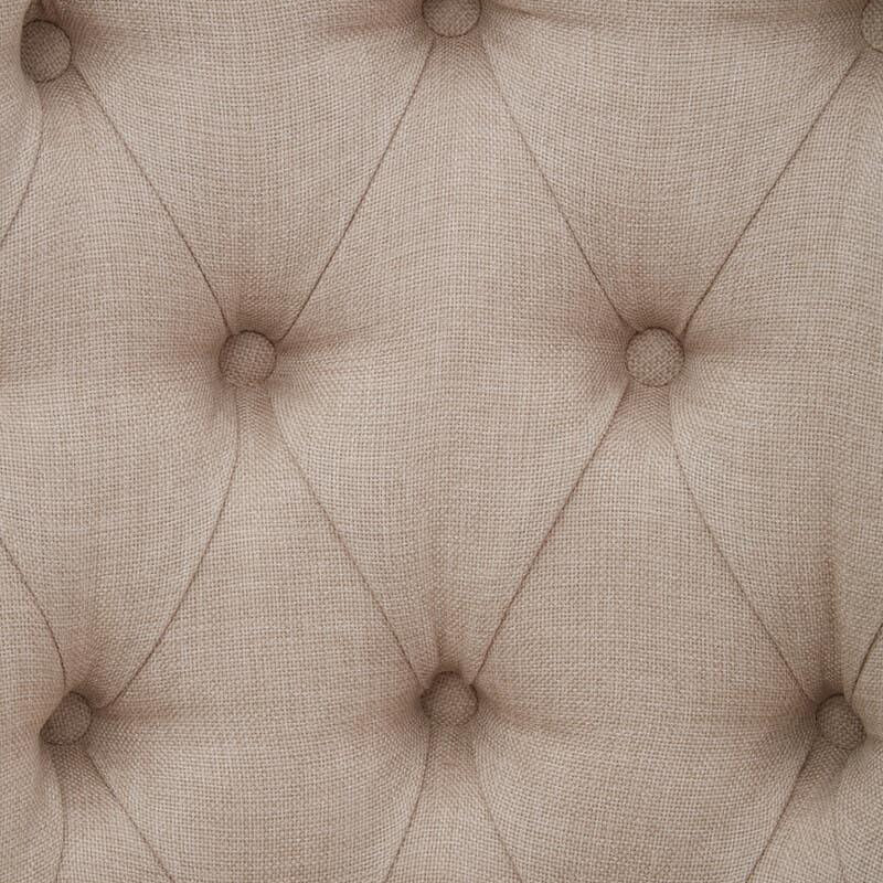 Beige linen upholstered sofa button-tufted detail close-up