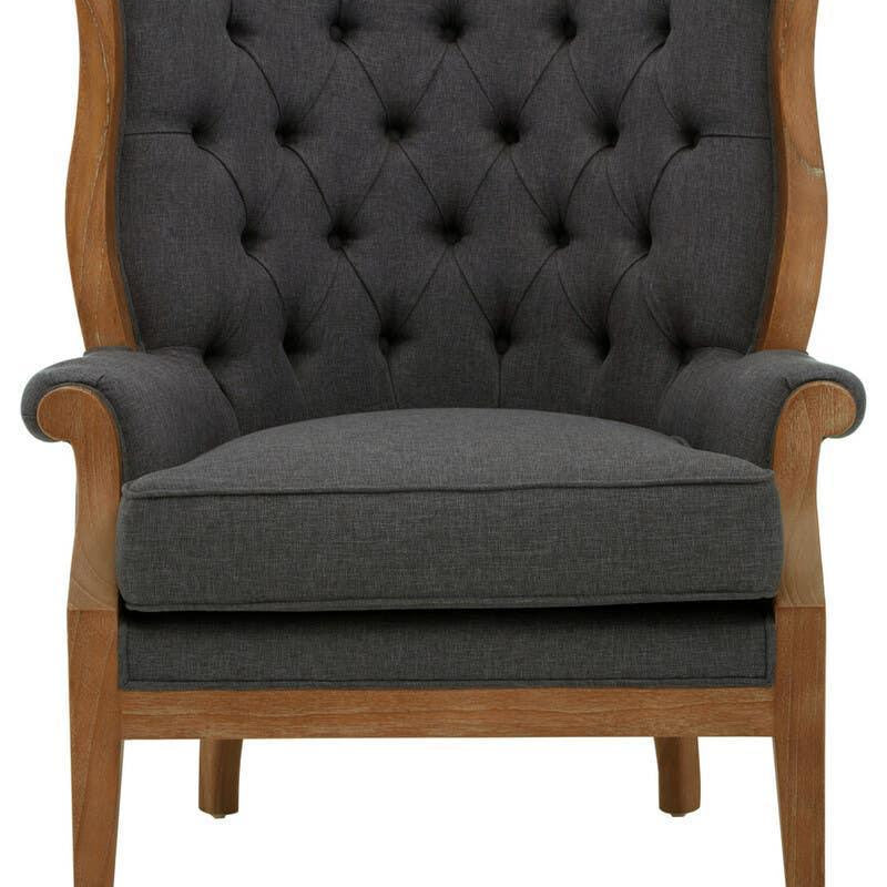Dark grey fabric armchair with button-tufted backrest and light wood frame, front view