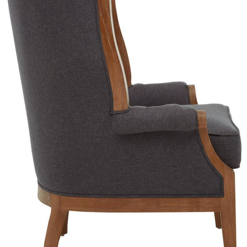 Side view grey fabric armchair with wooden legs and frame