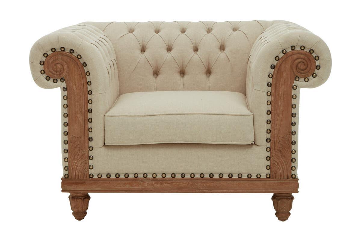 Beige armchair with button-tufted back, wood trim and nailhead detail, front view
