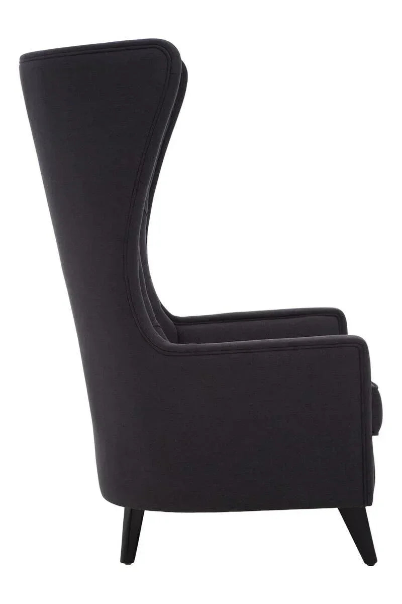 Side view of black high back armchair with fabric upholstery and tapered legs
