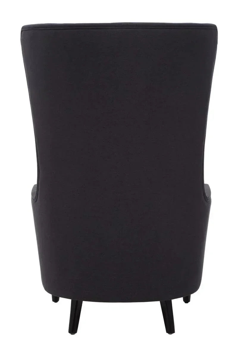 Rear view of black fabric accent chair with curved back and slim black legs