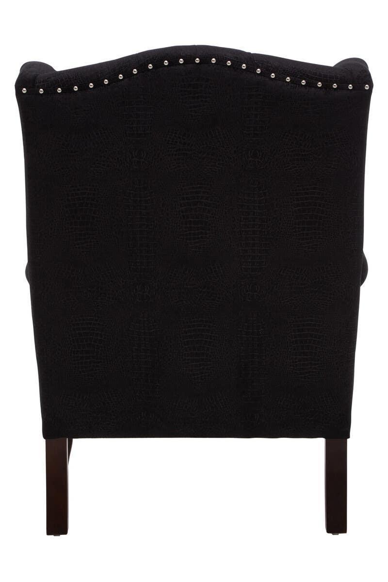 Back view black accent chair with crocodile pattern upholstery and silver stud trim