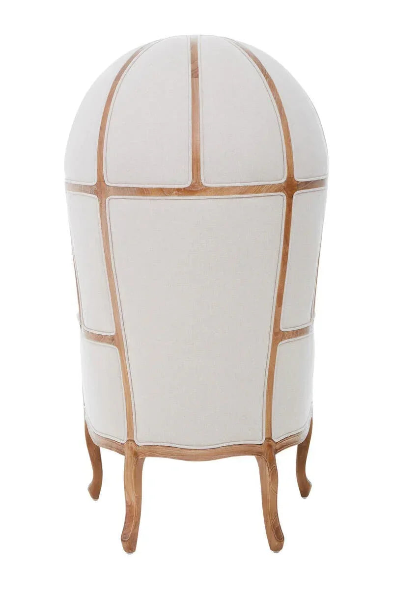 Back view of dome-shaped linen accent chair with exposed wooden frame and curved legs