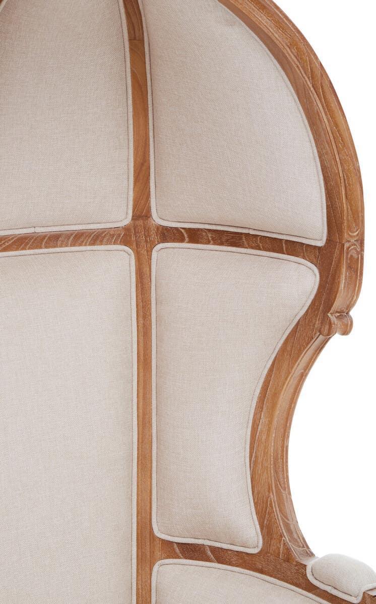 Natural wood armchair with beige upholstered high-back detail, close-up view