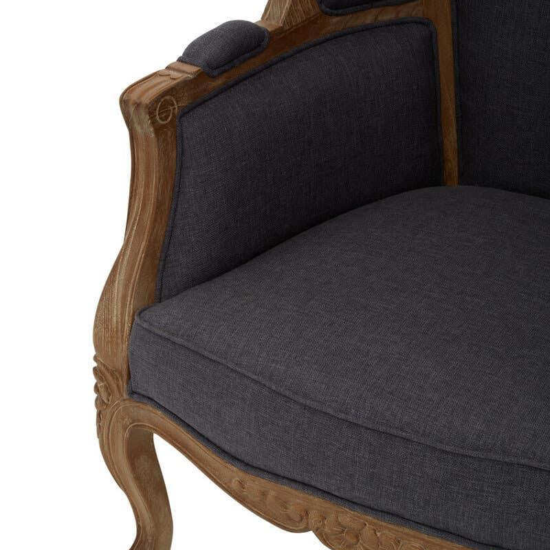 Dark grey upholstered armchair with carved wooden frame and curved legs, close-up view