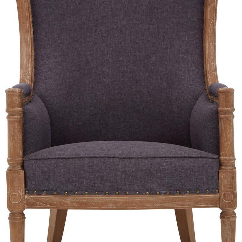 Dark grey upholstered armchair with wooden frame and decorative nailhead trim, front view