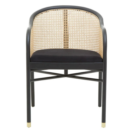 Black dining chair with cane backrest, rounded arms, cross base and gold foot accents