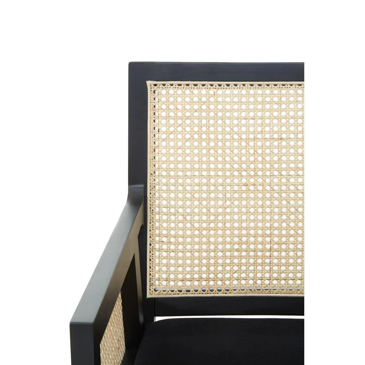 Black armchair with woven cane backrest and arm detail, angled close-up view