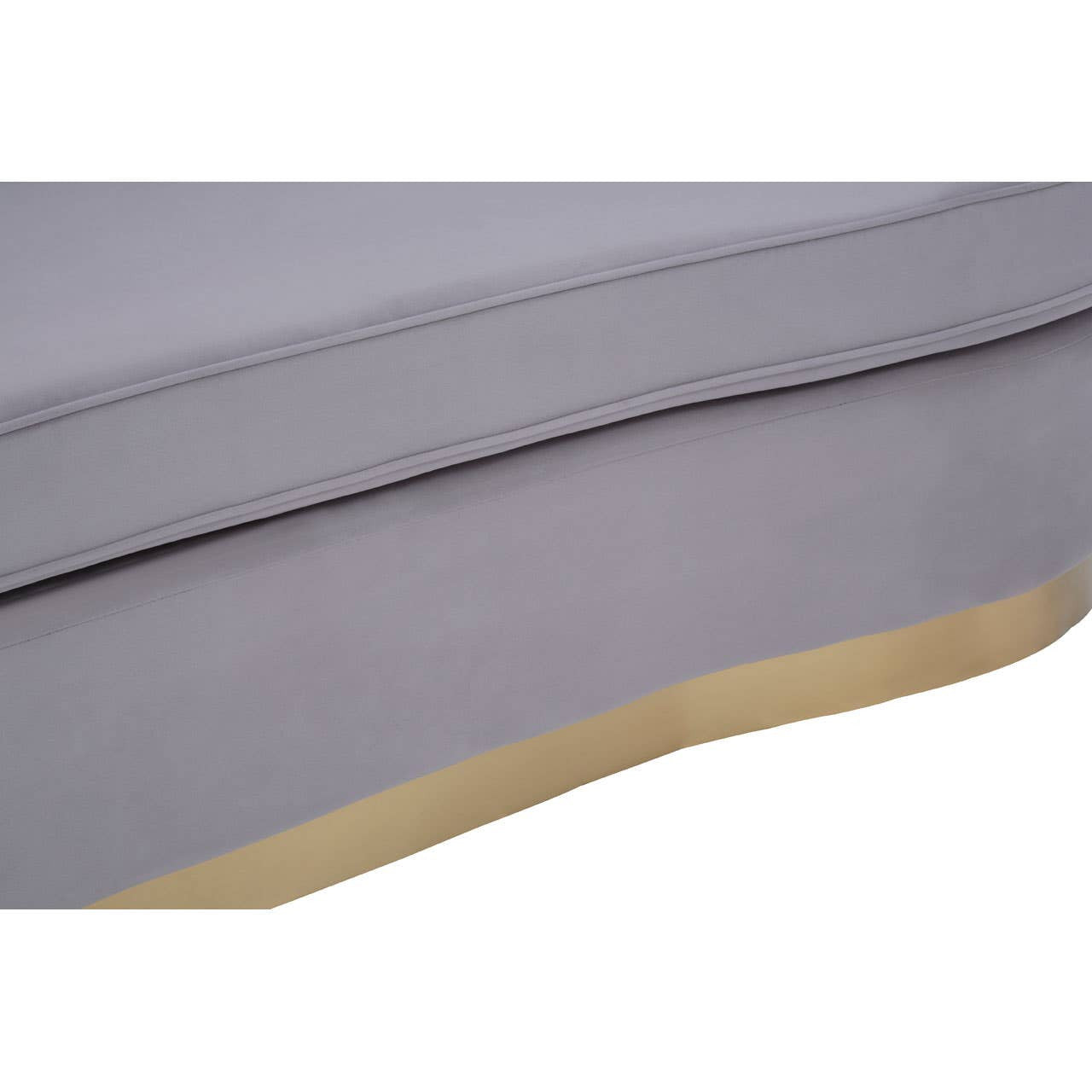 Pleated grey velvet upholstery of a three-seat sofa with a smooth, rounded edge and a light-colored base. The fabric appears soft and luxurious, showcasing subtle texture and depth