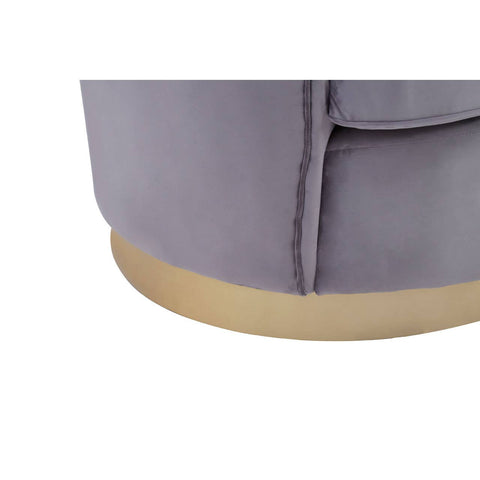 Close-up view of the base of a grey pleated velvet sofa, featuring a smooth, light wooden bottom and soft fabric texture