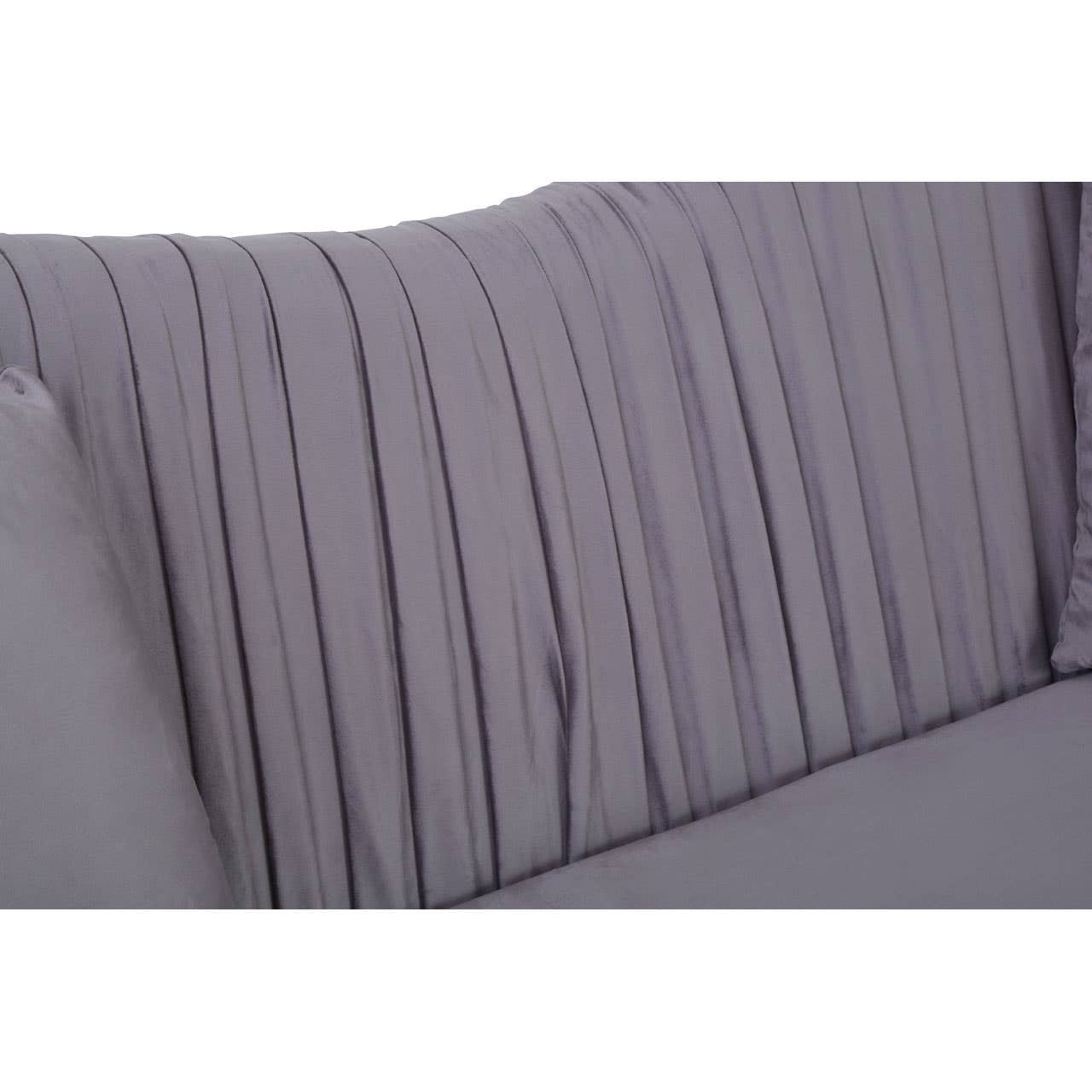 Close-up view of the pleated backrest of a grey velvet sofa, showcasing soft fabric texture and vertical pleats that add a modern touch. The sofa features a sleek design suitable for contemporary home decor