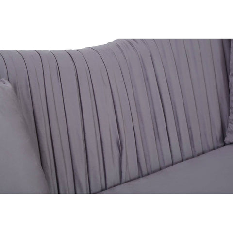 Close-up view of the pleated backrest of a grey velvet sofa, showcasing soft fabric texture and vertical pleats that add a modern touch. The sofa features a sleek design suitable for contemporary home decor