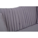 Close-up view of the pleated backrest of a grey velvet sofa, showcasing soft fabric texture and vertical pleats that add a modern touch. The sofa features a sleek design suitable for contemporary home decor