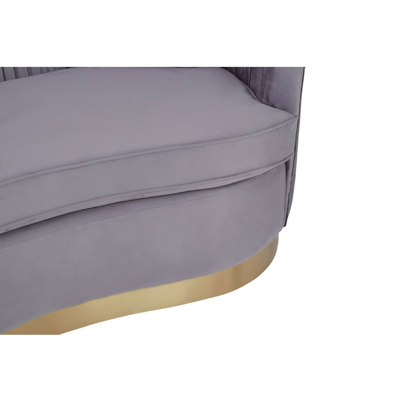 Pleated grey velvet upholstery of a two-seat sofa with a curved design and a gold-colored base