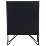 Textured black wooden cabinet with a minimalist design, featuring a sleek, angular metal base and a smooth front surface. The cabinet stands on four slender legs, adding a modern touch to any room