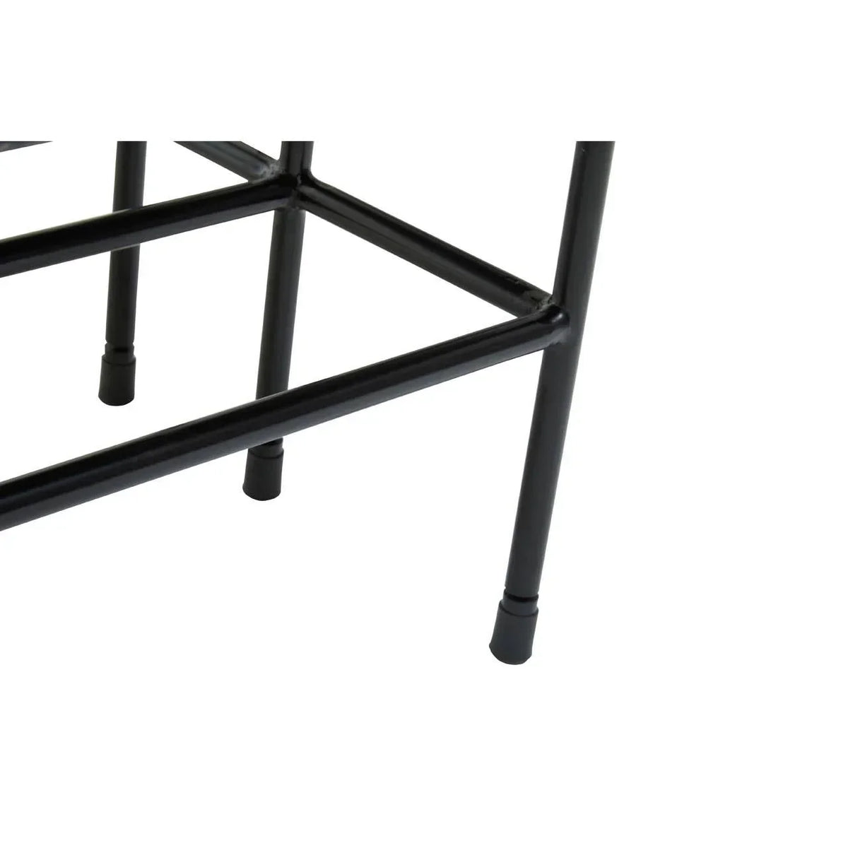 Black metal furniture legs and frame with rubber feet, close-up of corner supports