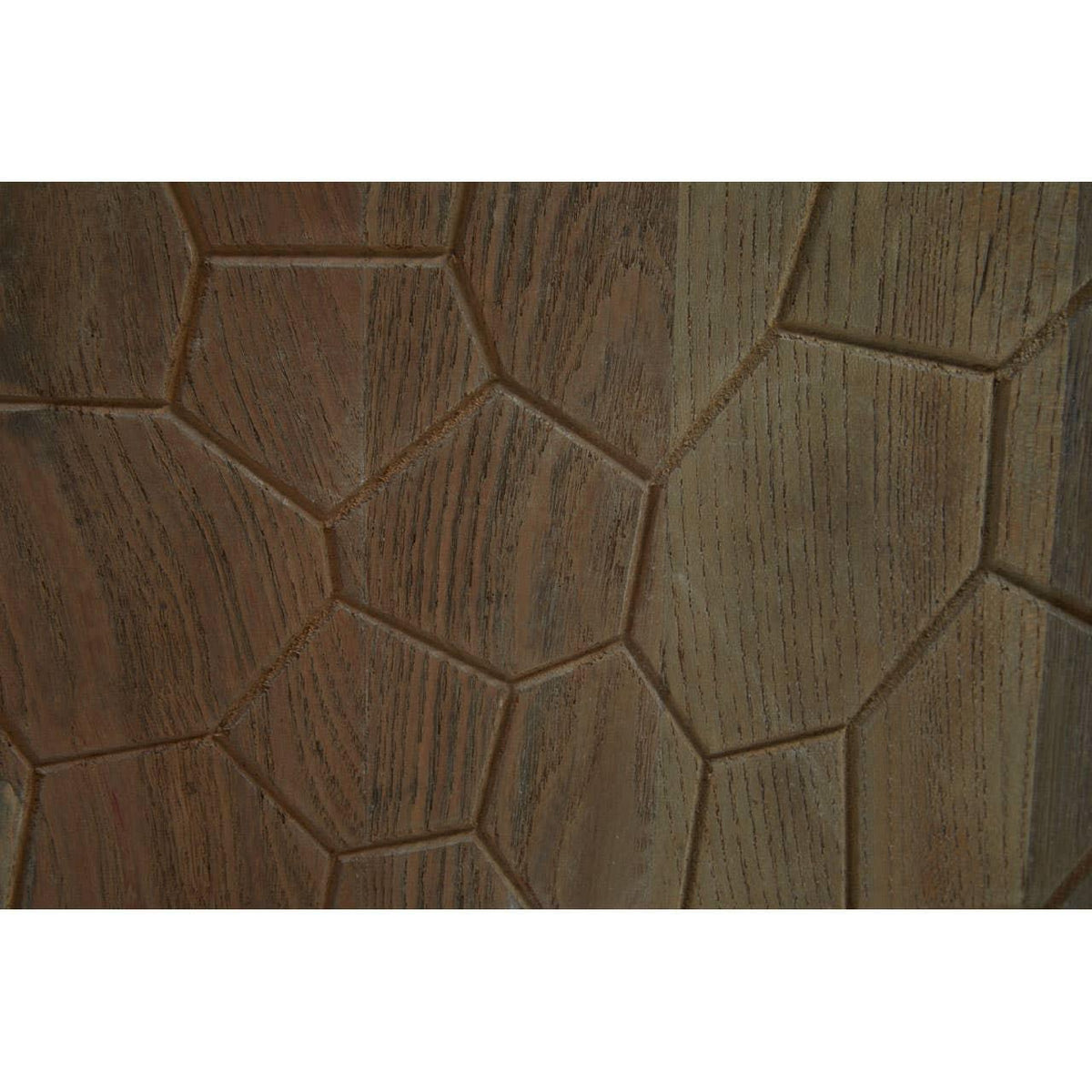 Brown wooden furniture surface with geometric carved pattern close-up