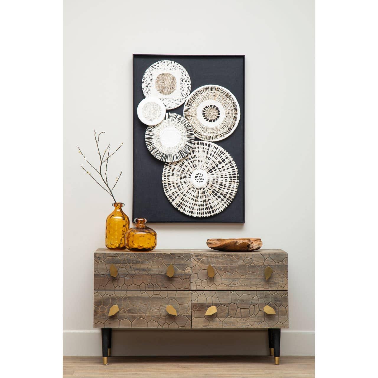 Rustic wooden sideboard with geometric pattern, amber glass vases, and woven wall art decor