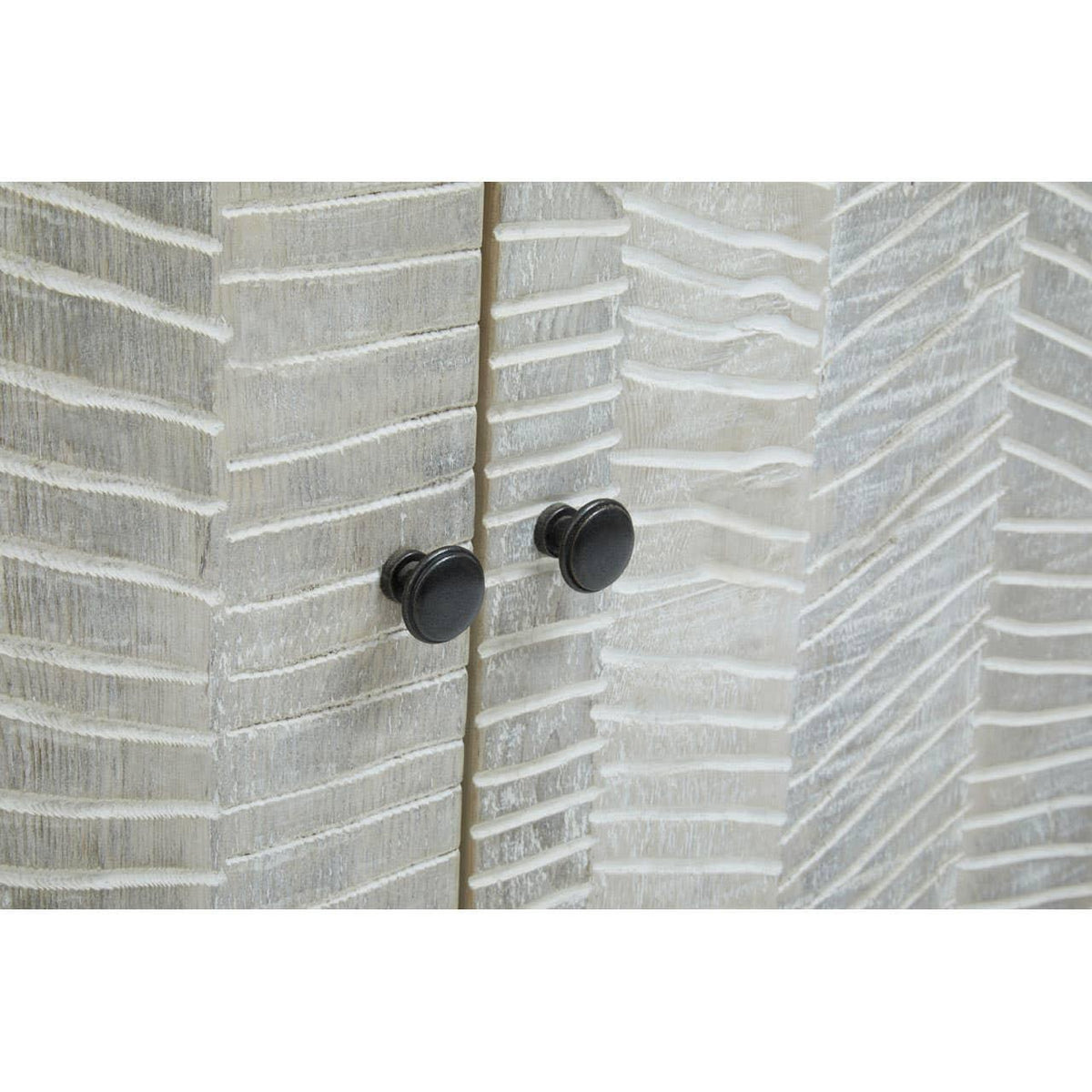 Textured wood cabinet doors with black round handles and chevron pattern detail
