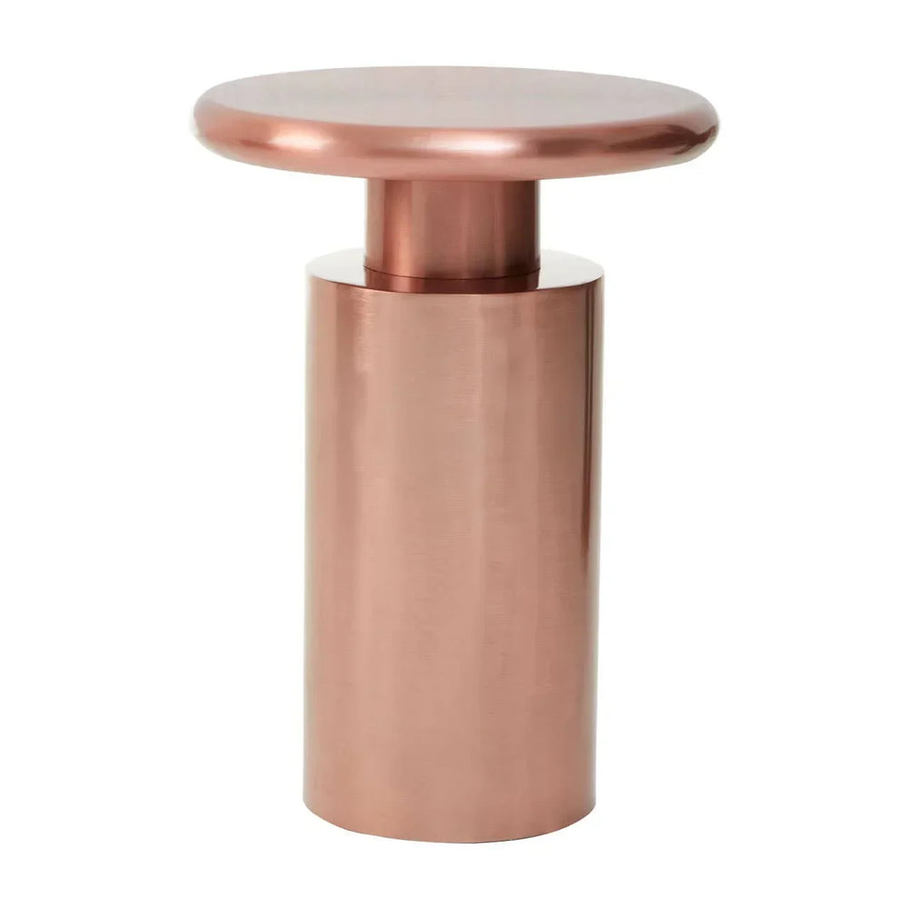 Round copper metal side table with cylindrical base on white background