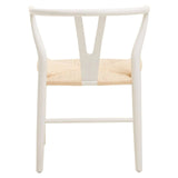 White dining chair with curved backrest and woven natural seat, rear view