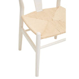 White wooden dining chair with natural woven seat, partial side and seat view