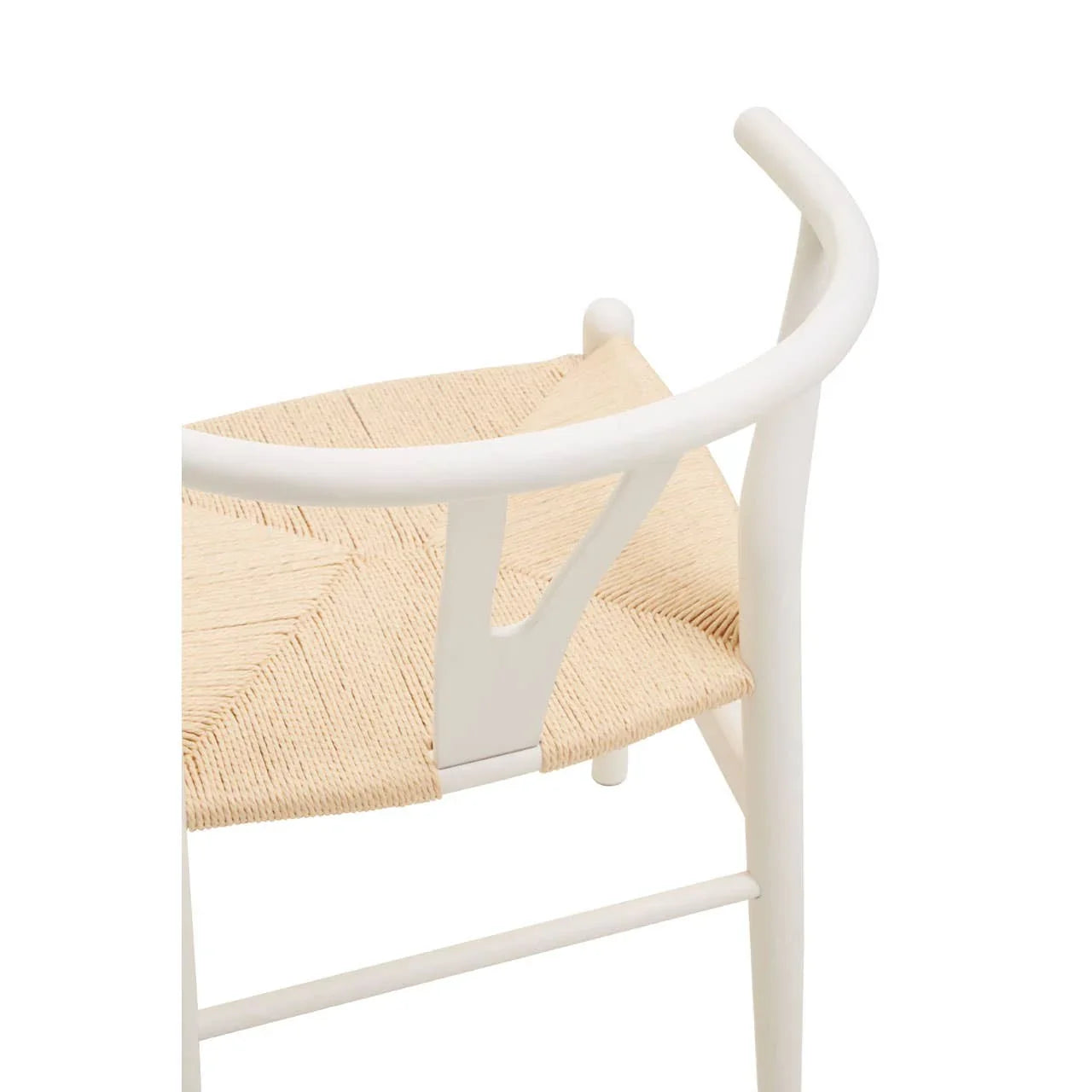 White wooden dining chair with curved backrest and woven natural seat, closeup view