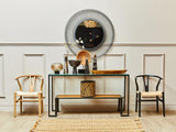 Modern hallway console table with decorative vases, round wall mirror and two accent chairs