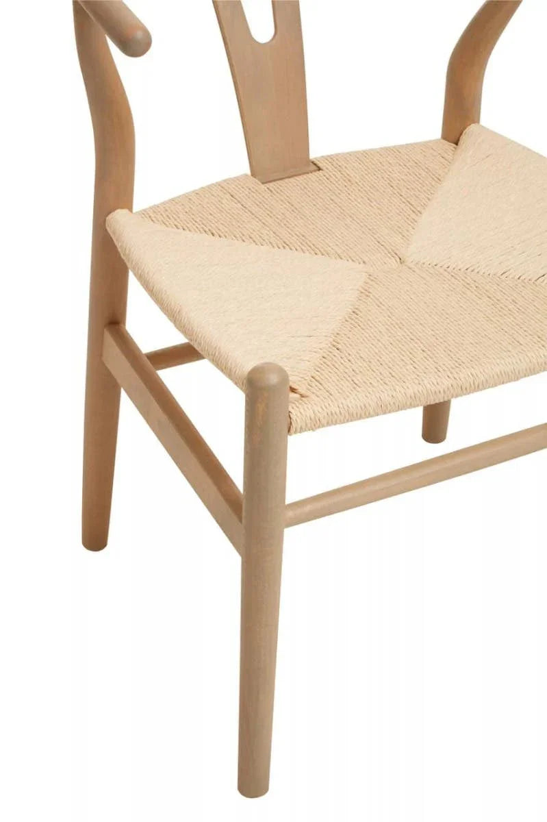 Natural wood dining chair with woven rope seat and curved backrest, close-up view