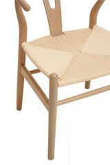 Natural wood dining chair with woven rope seat and curved backrest, close-up view