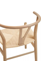 Natural wood dining chair with curved back and woven seat detail, rear angle view