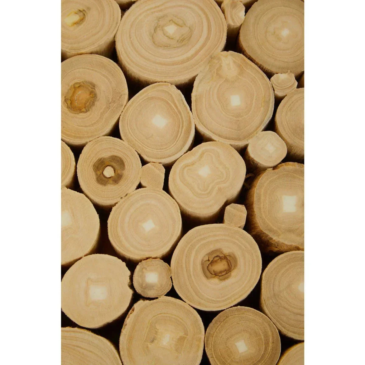 Close-up of stacked light wood logs showing natural rings and grain pattern